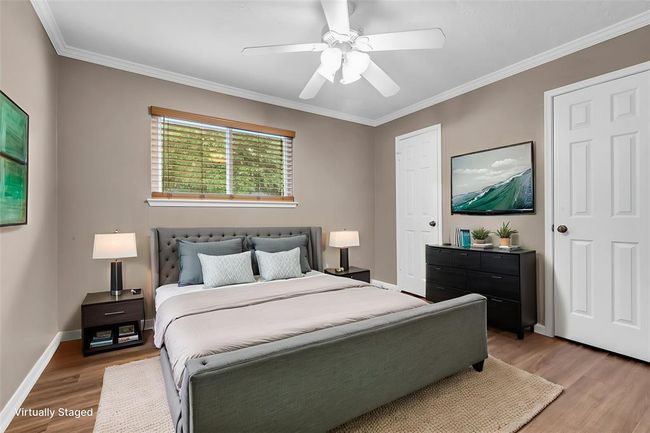 Upstairs third bedroom with LVP flooring. | Image 5