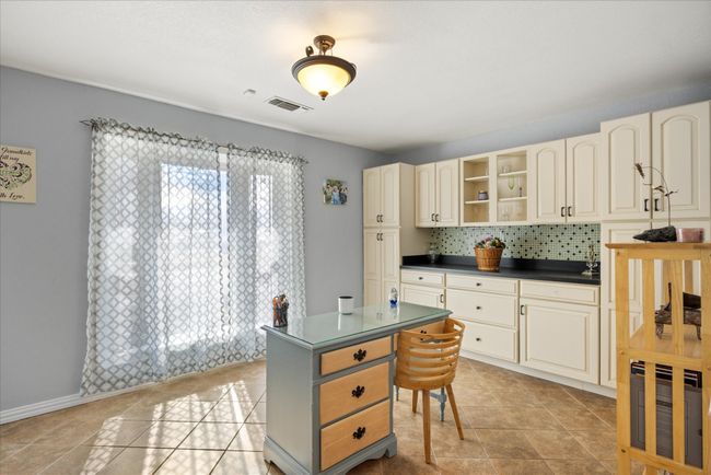 Dining area with built in cabinets | Image 12