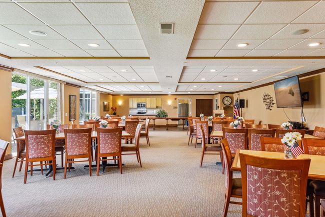 The Ridge Room is a lively space for pot luck dinners, community parties, association meetings, and Saturday night movies. It offers a direct access to a patio with picnic tables and grills for all to use. | Image 26