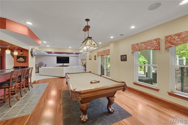 Game room with light wood-style floors, recessed lighting, and pool table | Image 50