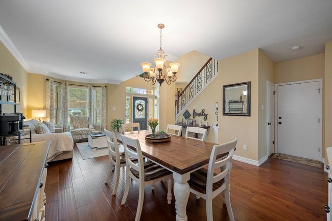 The formal dining area has room for a large table to join for family gatherings | Image 8