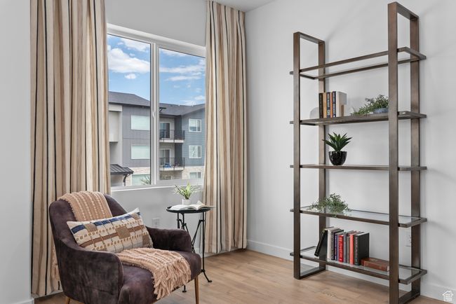 Sitting room featuring wood finished floors and baseboards | Image 9
