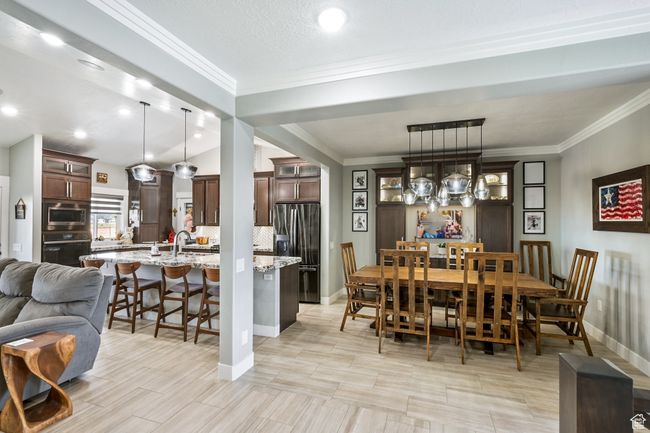 Dining room with ornamental molding and baseboards | Image 21