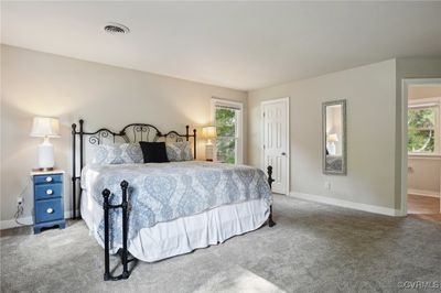 Bedroom featuring multiple windows and carpet floors | Image 3