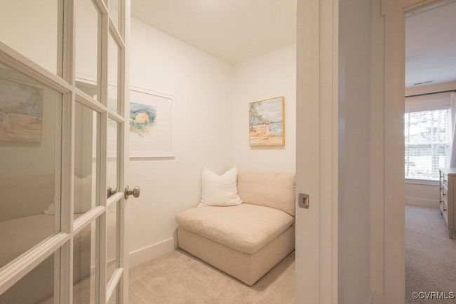 Living area with carpet flooring | Image 44