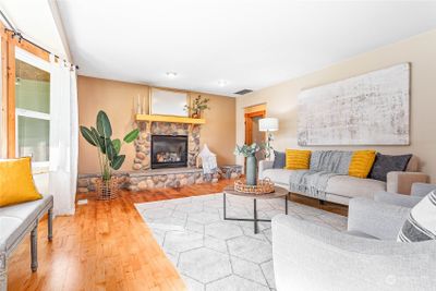 Love the bay window, door to right of fp leads to breakfast nook, garage & laundry | Image 3