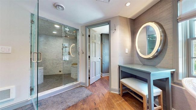 Bathroom with a shower with shower door and hardwood / wood-style flooring | Image 25