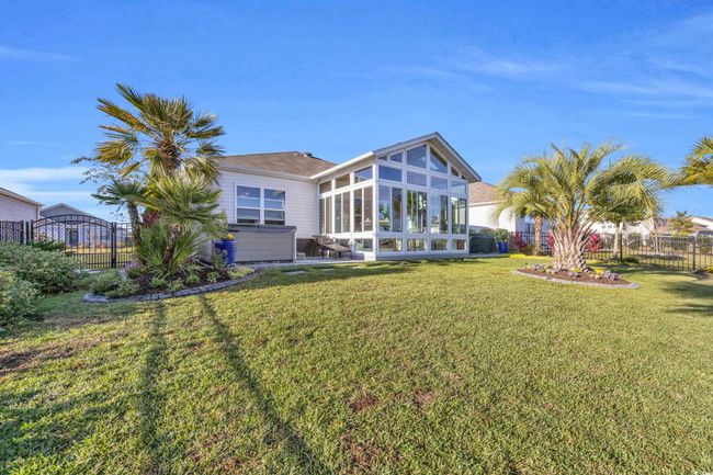 Back of property featuring a sunroom | Image 30