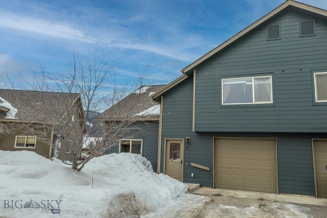 Exterior front entry to duplex style chalet & single attached garage | Image 25