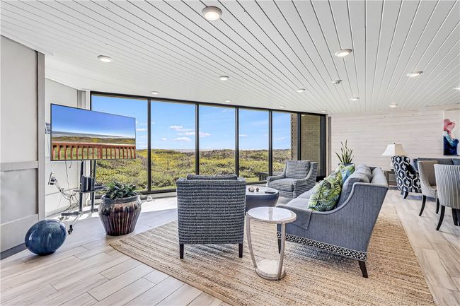 Sandpiper coffee and recreation area with TV and comfy chairs. | Image 33