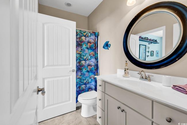 Bedroom featuring baseboards, wood finished floors, and a ceiling fan | Image 29