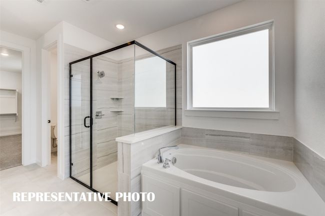 Whether it is soaking your cares away or taking a long, luxurious shower, this owner's bath is the perfect place to start or end your day. REPRESENTATIVE PHOTO | Image 13