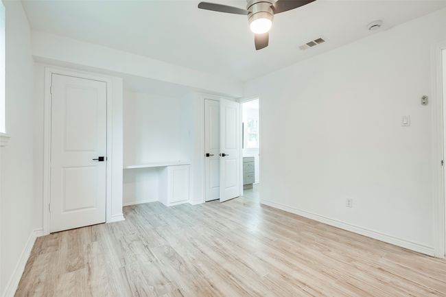 Unfurnished bedroom featuring wood finished floors and a ceiling fan | Image 22