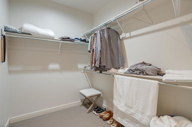 Walk in closet featuring carpet flooring | Image 37