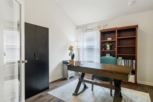 Office featuring baseboards, lofted ceiling, and dark wood finished floors | Image 4