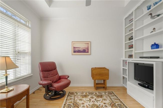 Sitting room featuring crown molding, light wood-style flooring, and baseboards | Image 33