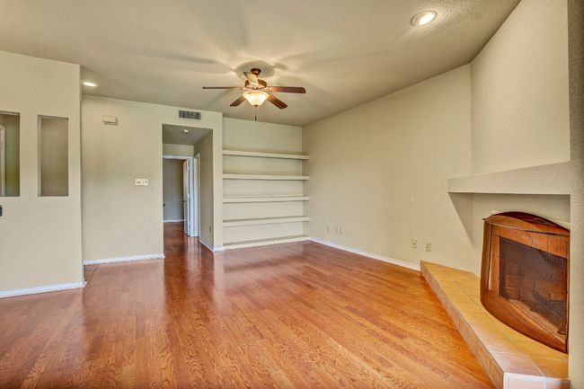 Living room with raised hearth and wood floors | Image 8