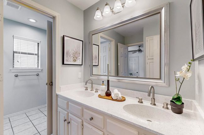 Full bathroom featuring double vanity, tile patterned flooring, and a ceiling fan | Image 32