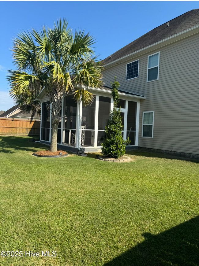 Exterior view of screened-in porch. | Image 4