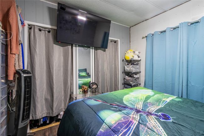 Bedroom featuring wood finished floors | Image 10