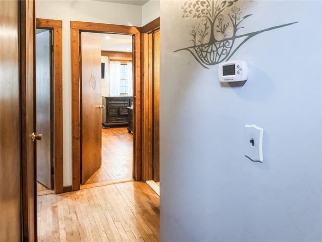 Hallway featuring hardwood / wood-style flooring | Image 15