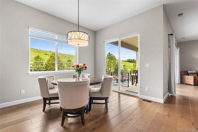 Dining room with upgraded chandelier and direct access to backyard | Image 18