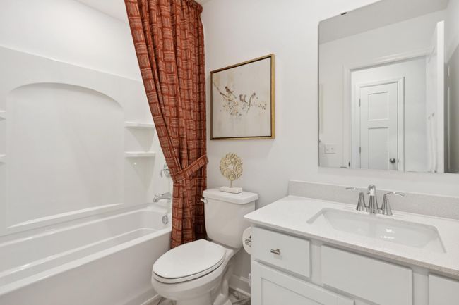 (Photo of decorated model, actual home's finishes may vary slightly) A full bath located on the main floor! | Image 14
