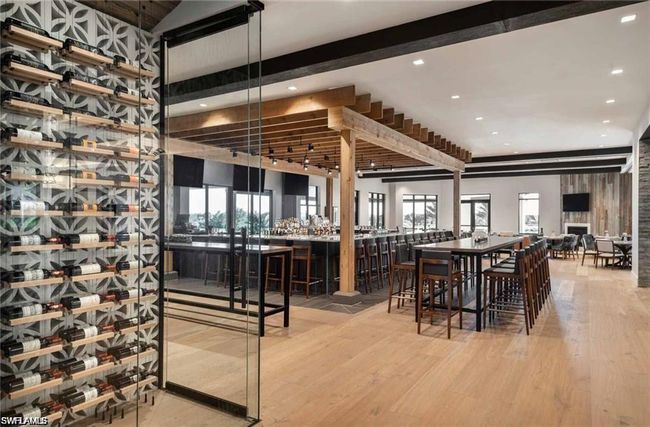 Dining room with wood finished floors, recessed lighting, and beam ceiling | Image 37