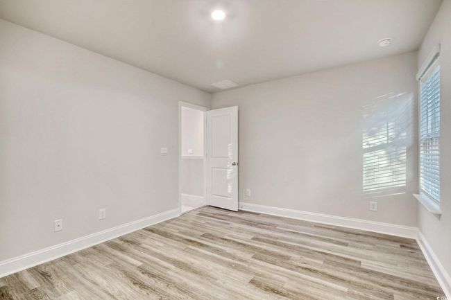 Unfurnished room with plenty of natural light and light wood-type flooring | Image 24