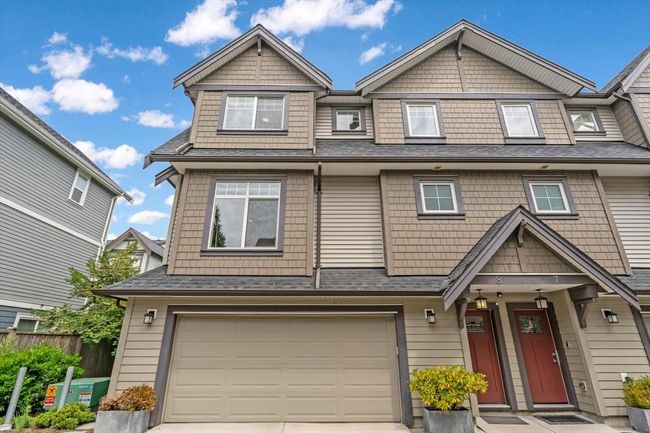 View of front of home featuring an attached garage and driveway | Image 25