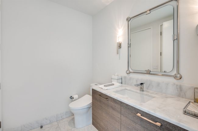 Bathroom with marble look tile flooring and vanity | Image 16
