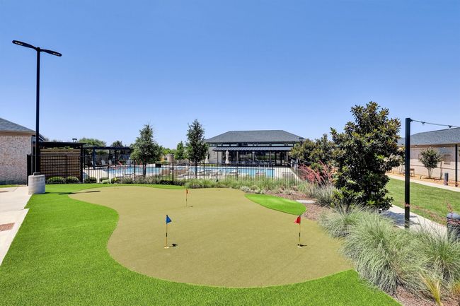 View of property's community featuring a putting green and a pool | Image 28