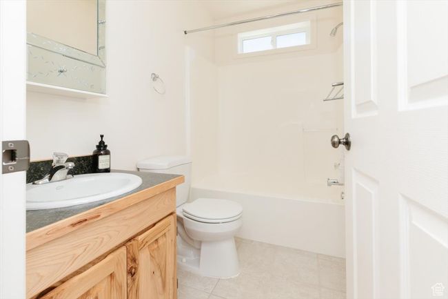 Full bathroom featuring vanity, shower combination, and tile patterned flooring | Image 26