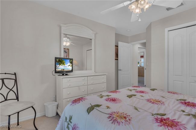 Bedroom with a closet, a ceiling fan, and baseboards | Image 22