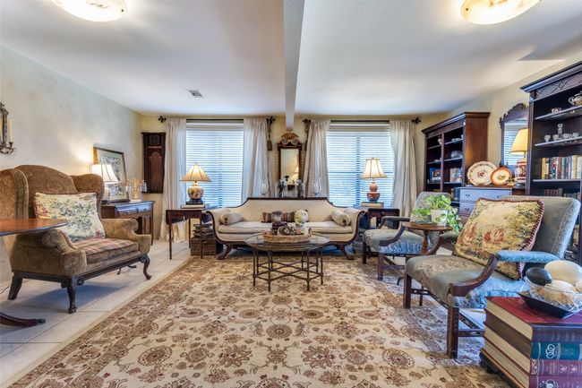 Tiled living room featuring beamed ceiling | Image 8