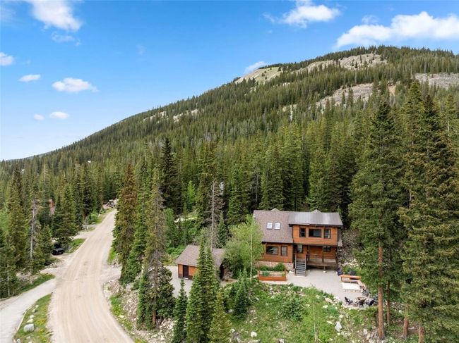 View of subject property with a forest and a mountain backdrop | Image 42