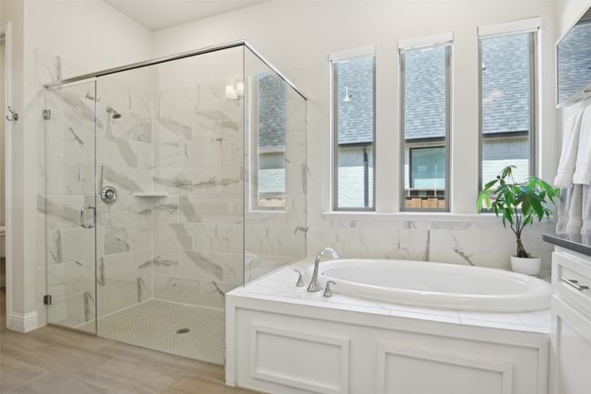 Bathroom with a garden tub and a shower stall | Image 21