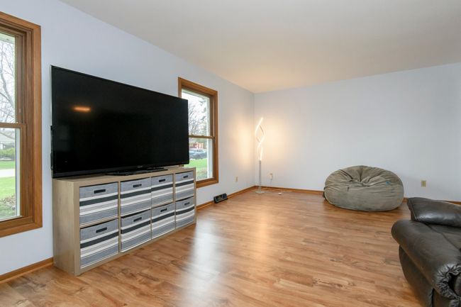 Living Room. Vinyl clad thermal windows. New vinyl plank flooring, paint, and vent covers | Image 5