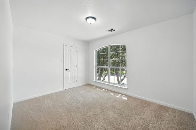 Carpeted spare room with baseboards | Image 19