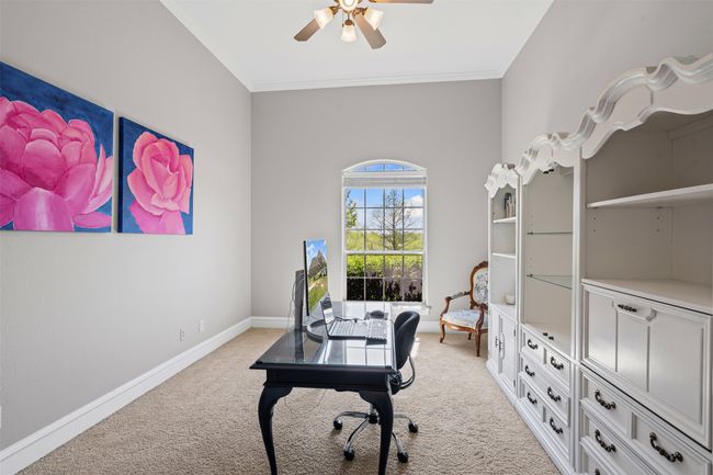 Office with ornamental molding, baseboards, a ceiling fan, and light carpet | Image 26