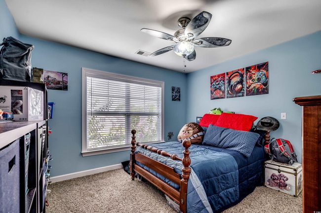 Bedroom featuring carpet floors and a ceiling fan | Image 25