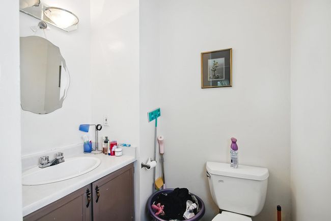 Bathroom featuring toilet and vanity | Image 21