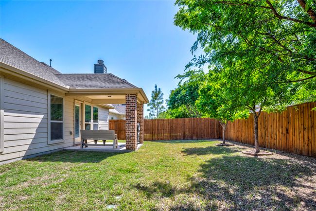 View of yard with a patio area and a fenced backyard | Image 37
