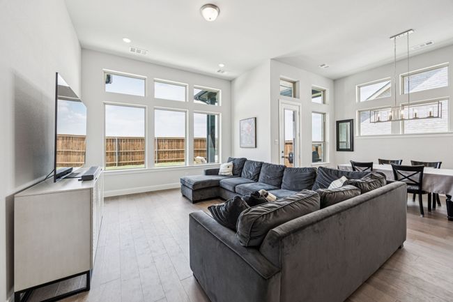 Living room featuring hardwood / wood-style floors, baseboards, and recessed lighting | Image 20
