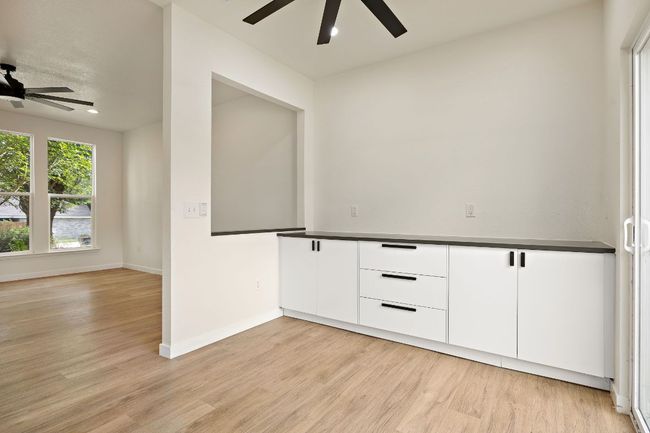 Spare room with a ceiling fan, light wood-type flooring, and recessed lighting | Image 14