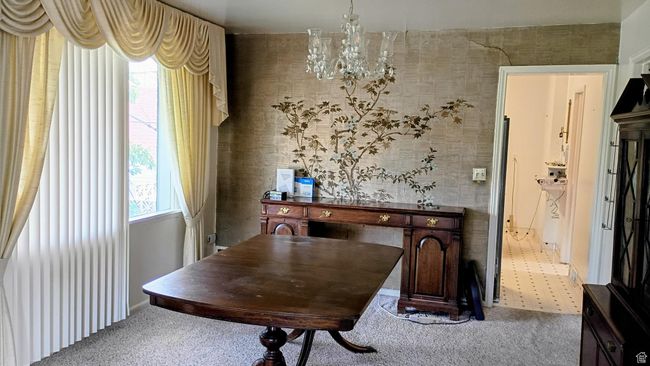Dining room featuring carpet floors and a chandelier | Image 14
