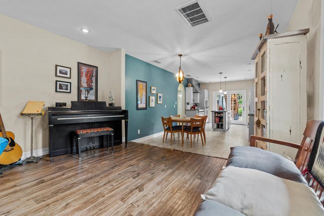 MAIN: Living room looking toward dining area and kitchen | Image 10