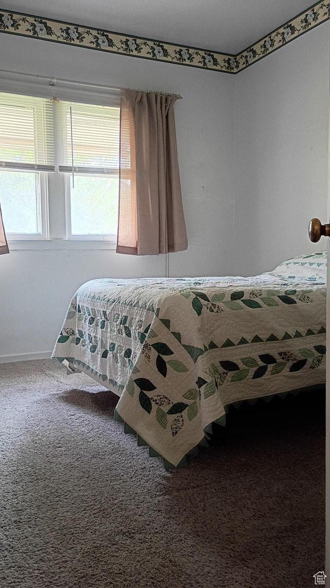 Bedroom with carpet flooring | Image 26