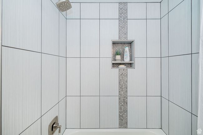 Interior details featuring a washtub and a shower | Image 27