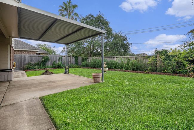 Additional side view of backyard. | Image 38